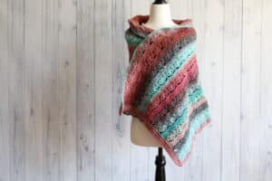 pink and blue lacy crochet shawl