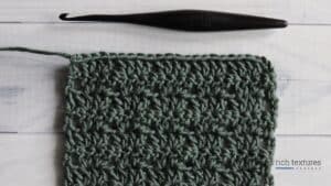 photo of twin v stitch swatch green white background crochet hook