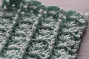 post and shell stitch shown on angle in blue