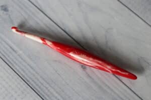 red and white Furls Crochet hook