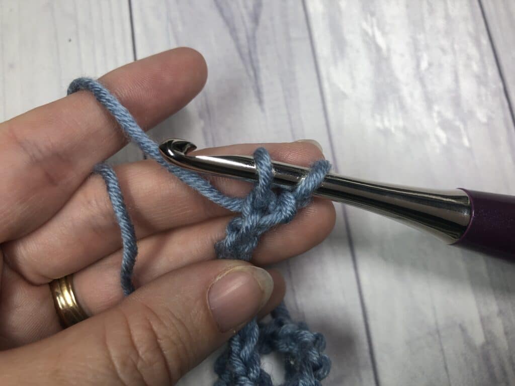 step one of linked double crochet stitch