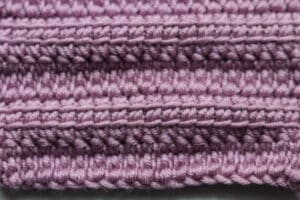 close up of crochet stitches, pink