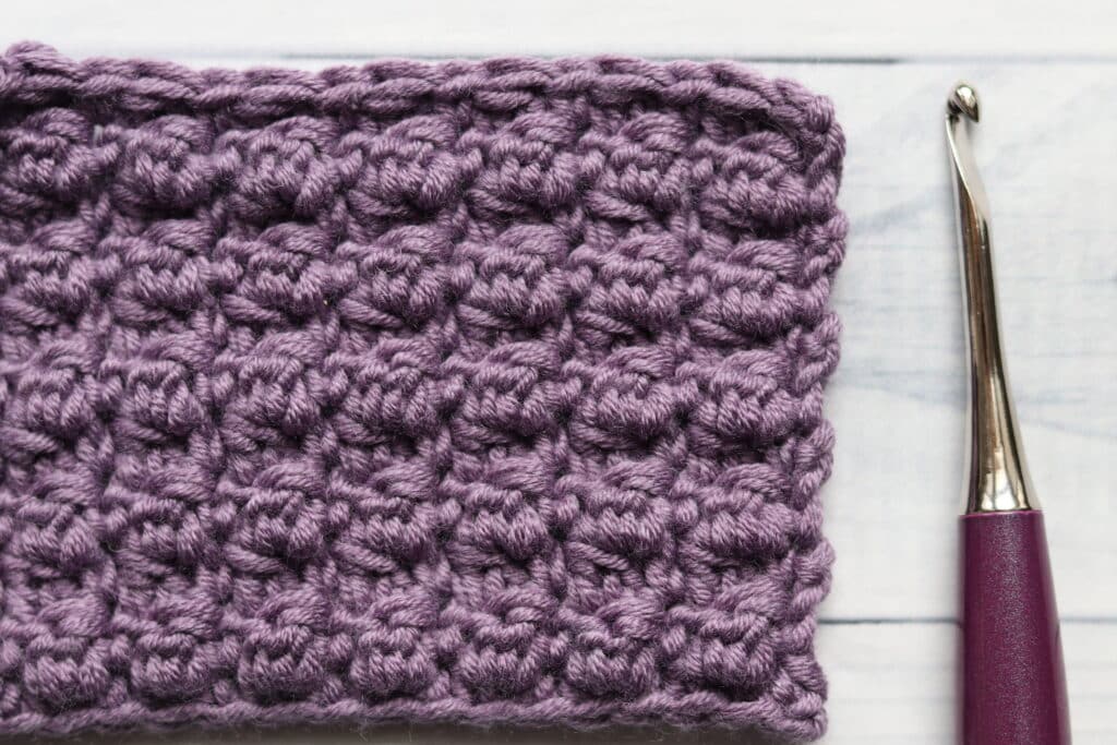 double crochet cluster stitch in purple colour