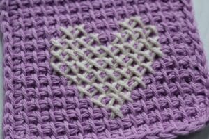 close up of easy Tunisian crochet mug rugs