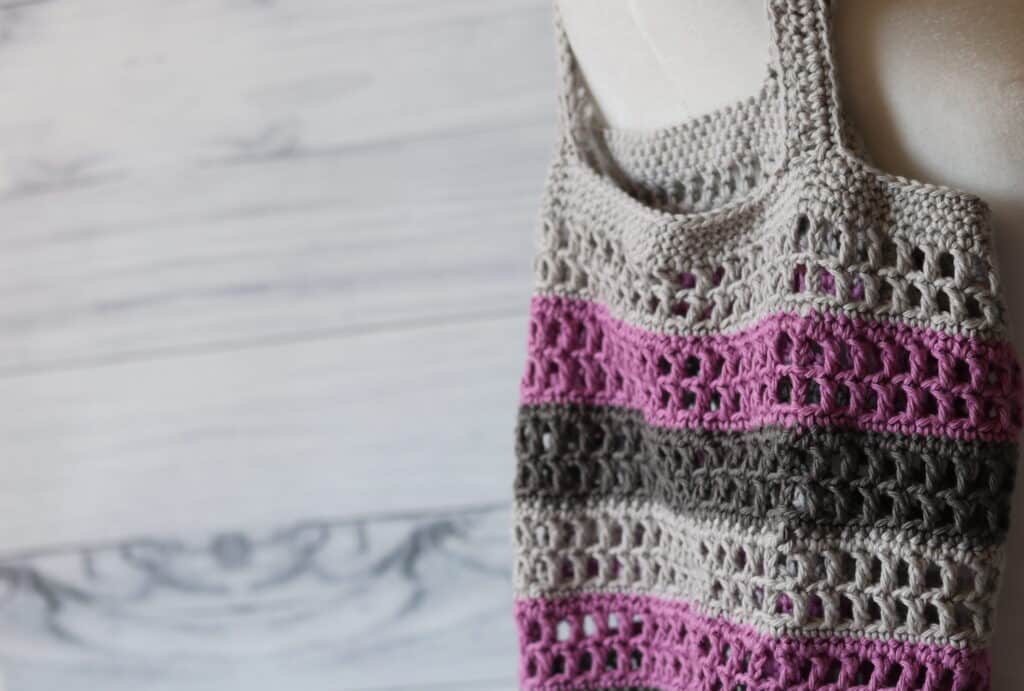 close up of crochet market bag on mannequin