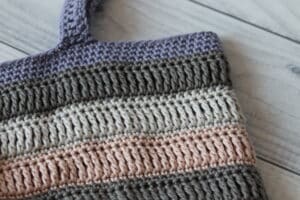 close up of a crochet market bag handle