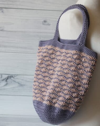 crochet market bag in pink and purple featuring the wave stitch