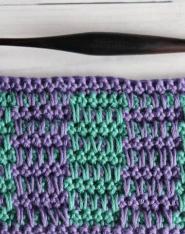 swatch of the crochet rake stitch in green and purple yarn