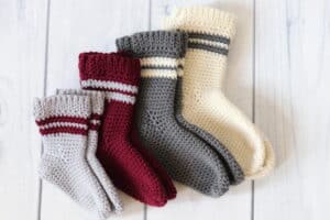 four pairs of crochet baby socks