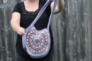 purple and pink crochet granny square bag