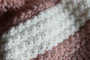 close up of the crochet stitches in the winterberry beanie