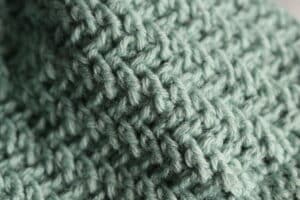 close up of the texture in the mountain ridge crochet hat