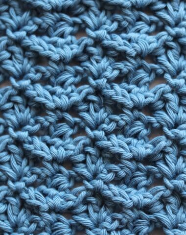 the fleur de lys crochet stitch worked in a solid blue colour