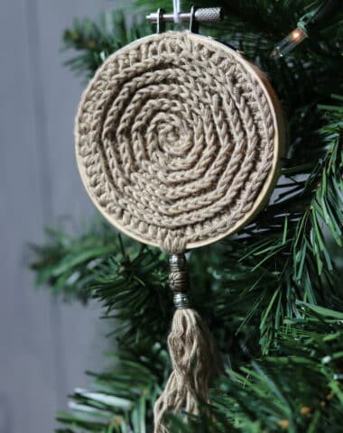 crochet christmas ornament hanging on a Christmas tree