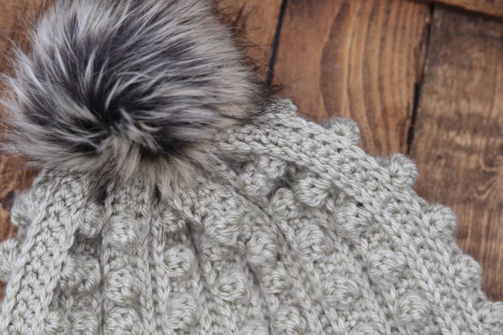 close up of the top and pom pom of the Rocky Crochet Beanie