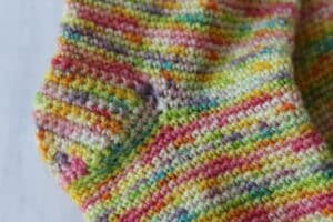 close up of the heel on a pair of crochet socks