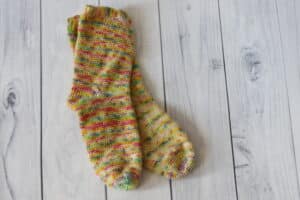 pair of yellow and pink crochet socks