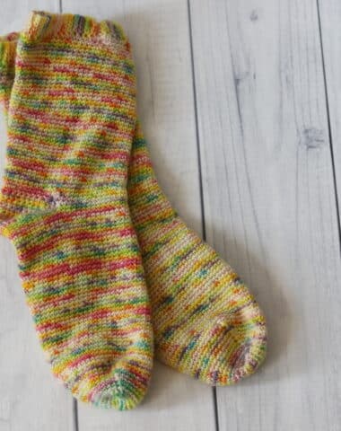 pair of yellow and pink crochet socks