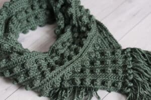 A Close up of the crochet Rocky Scarf in Green Yarn