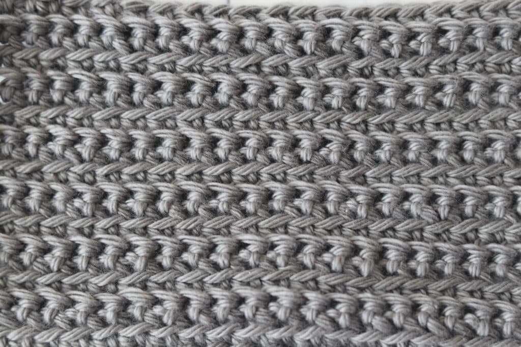 The front and back loop single crochet stitch worked in grey yarn