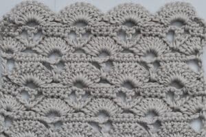 A beautiful shell crochet stitch pattern worked in grey yarn