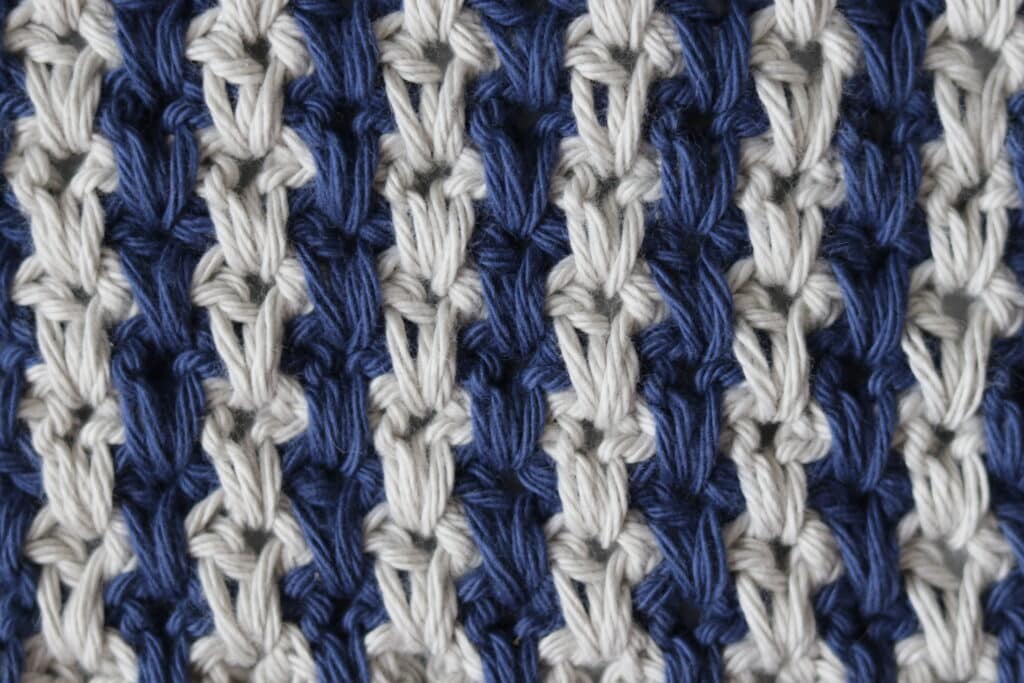 The Long Spiked Crochet v stitch worked in blue and grey yarn