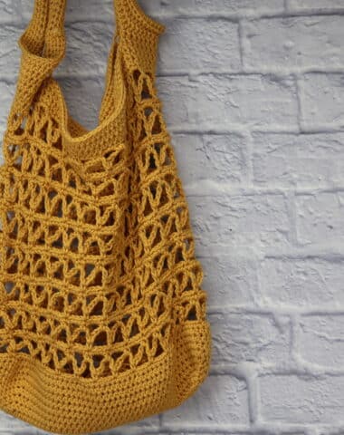 A golden coloured crochet market bag