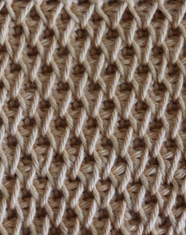 The honeycomb smock crochet stitch worked in a pale yellow yarn