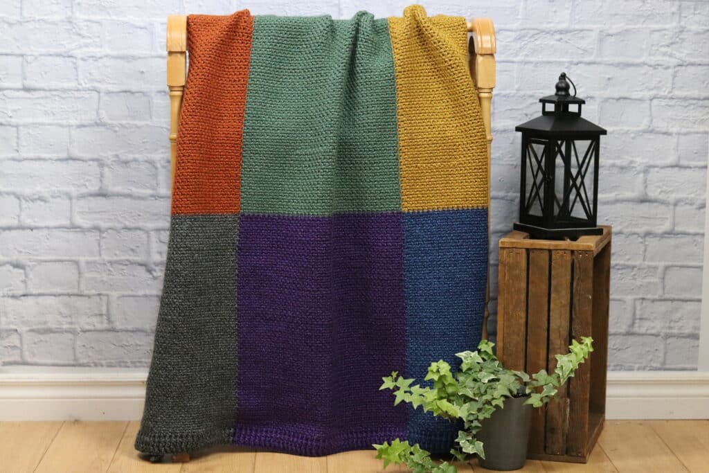 A Crochet Blanket featuring nine different coloured blocks