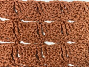 The Crochet Wedge Stitch worked in a copper coloured yarn