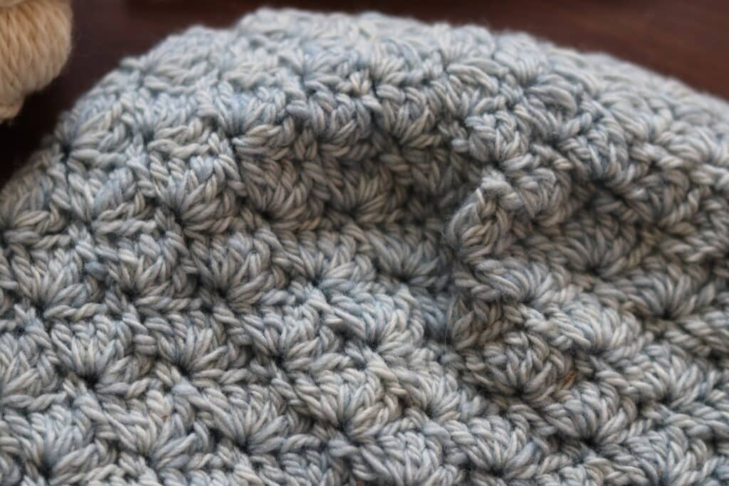 A Close up of the top of the Beach Point Beanie 