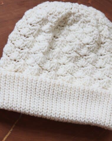 A Crochet Beanie featuring a shell stitch worked in white yarn