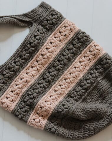 The crochet Jasmine Market Bag worked in grey and pink yarn