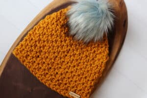 A Super Bulky Weight Crochet Beanie in golden coloured yarn
