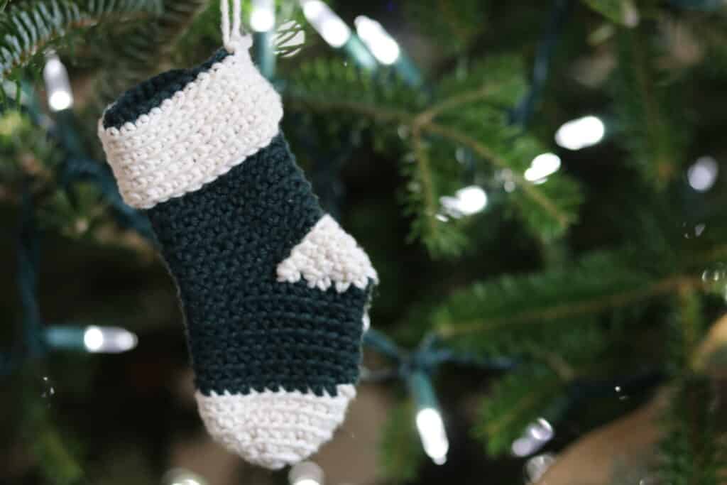 A green and white mini crochet Christmas Stocking