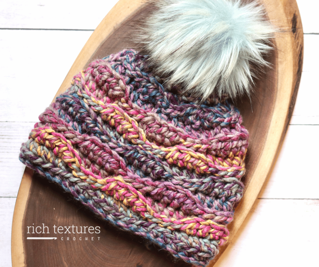 A textured crochet beanie worked in a multicoloured super bulky weight yarn