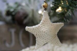 A Crochet star ornament worked in white yarn