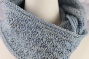 A Close up of the Beach Point Cowl worked in a blue grey yarn