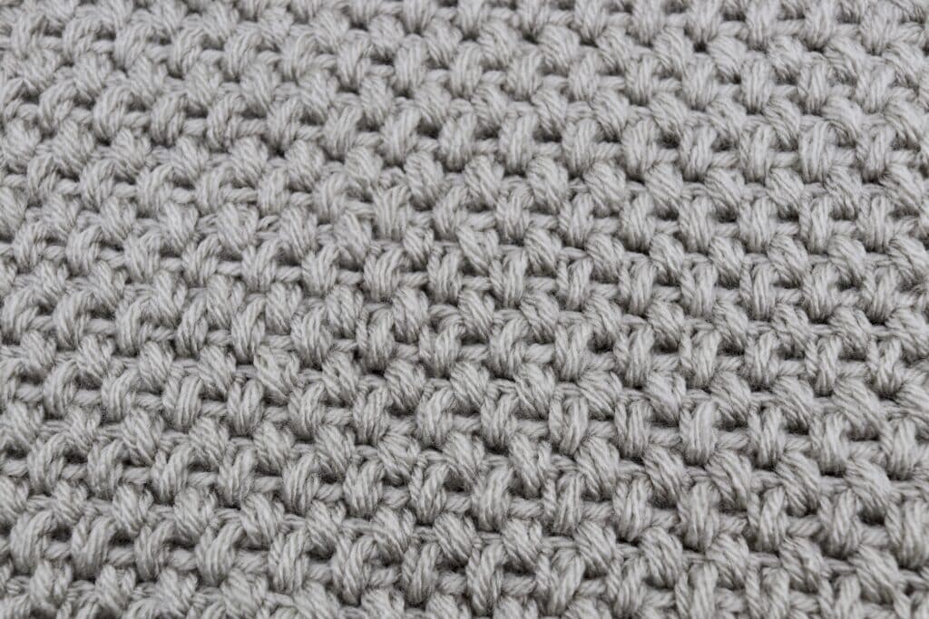 A close up of the Elizabeth stitch in a crochet afghan square