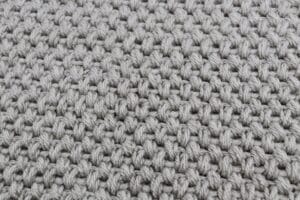 A close up of the Elizabeth stitch in a crochet afghan square