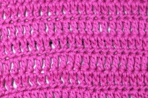 The half treble crochet stitch worked in a bright pink yarn