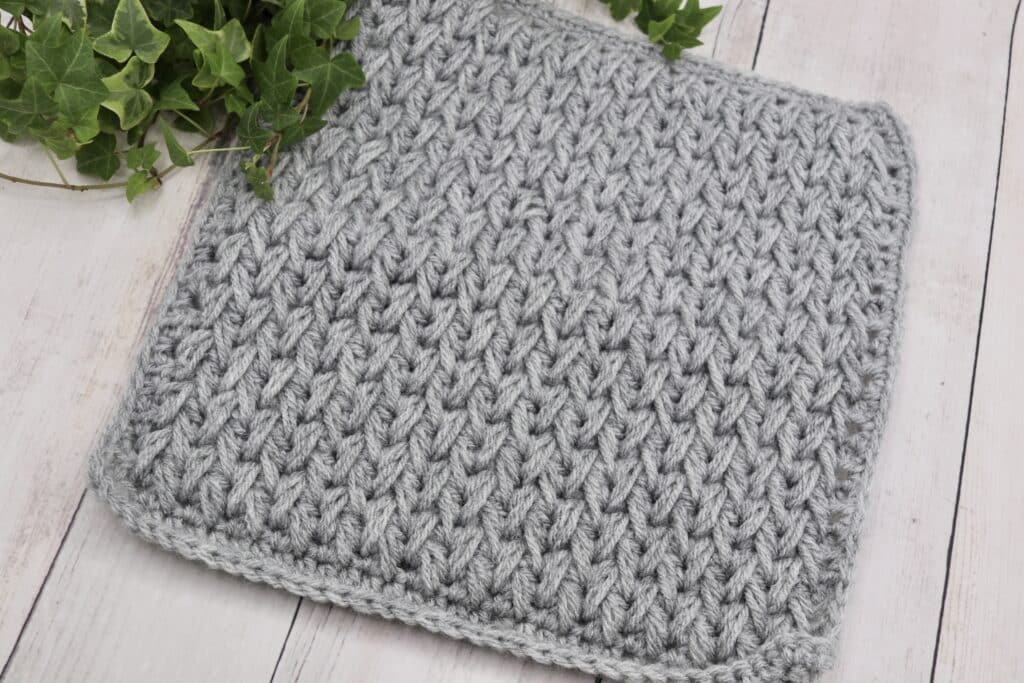 The Feathers Crochet Afghan Square worked in a grey yarn