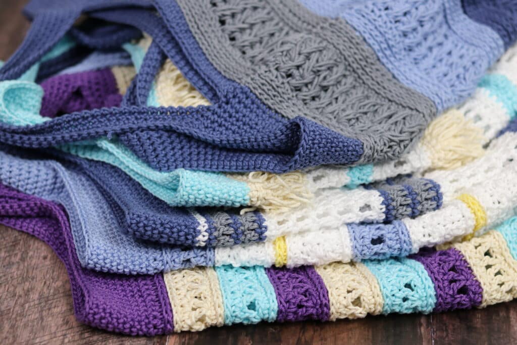 A pile of crochet market bags