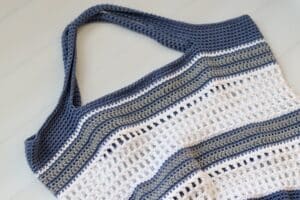 A close up of the handles on the Bay Window Crochet Market Bag