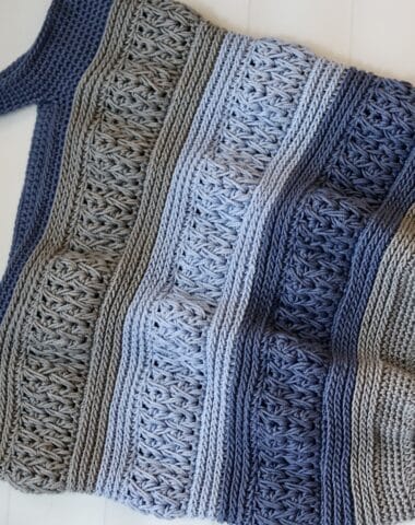 A dark blue, light blue and grey crochet textured market bag