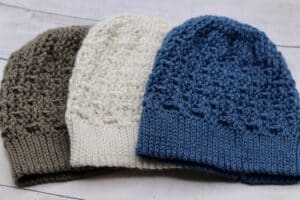 A set of three textured crochet beanies
