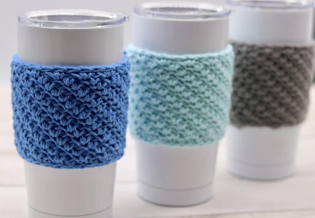 Three crochet cup cozies