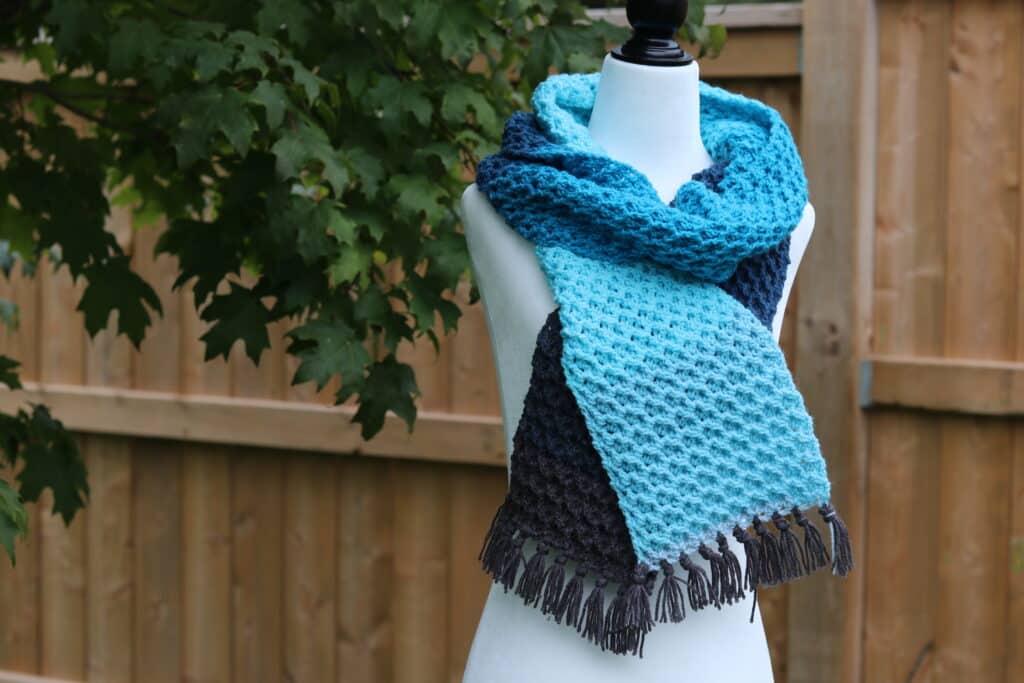 A textured crochet scarf featuring the pistachio stitch