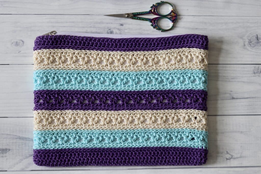 A crochet zippered accessory pouch