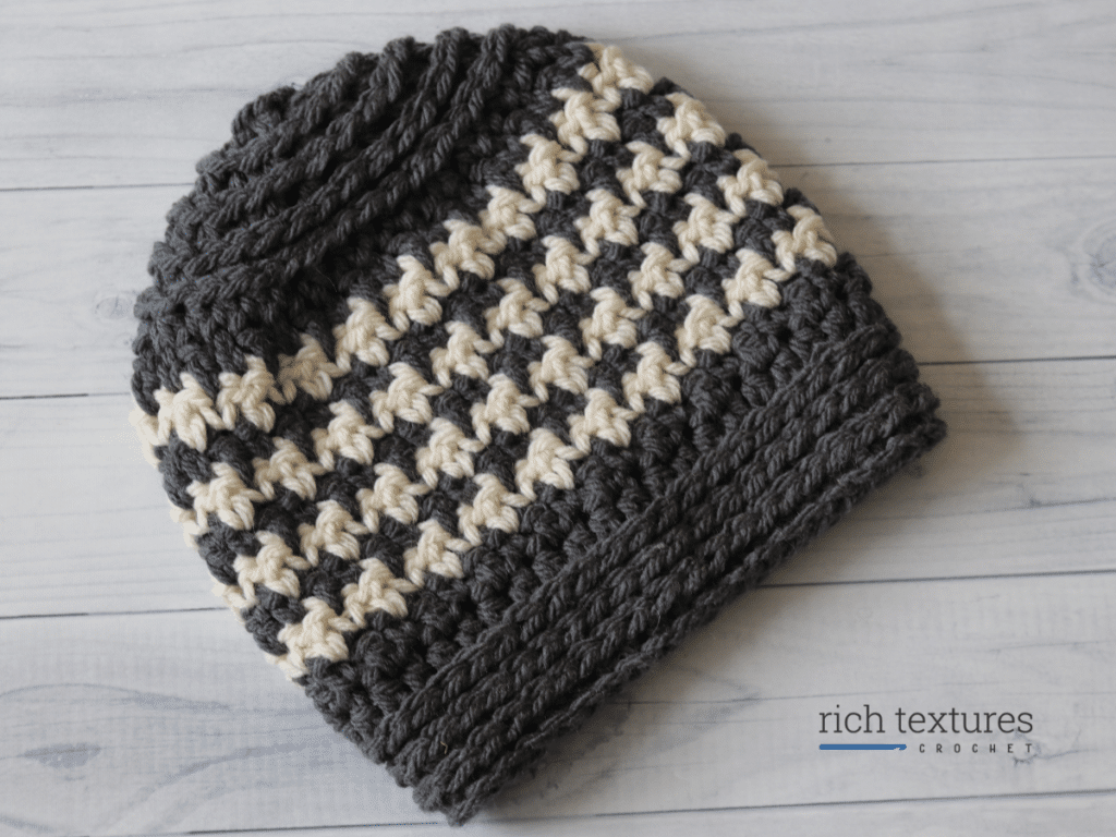 A bulky crochet hat featuring the houndstooth stitch pattern